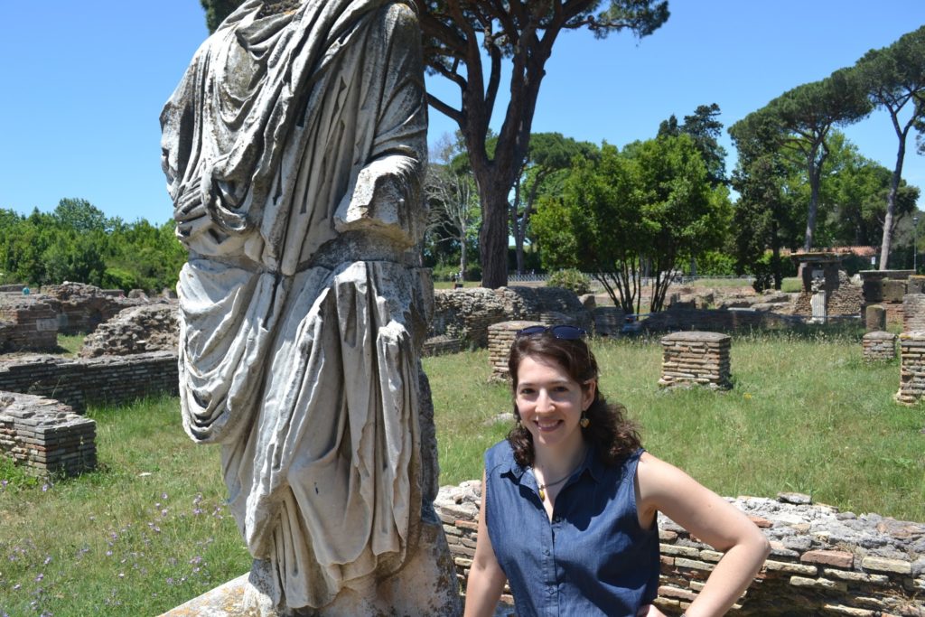 Leila Amineddoleh in front of a Roman ruin