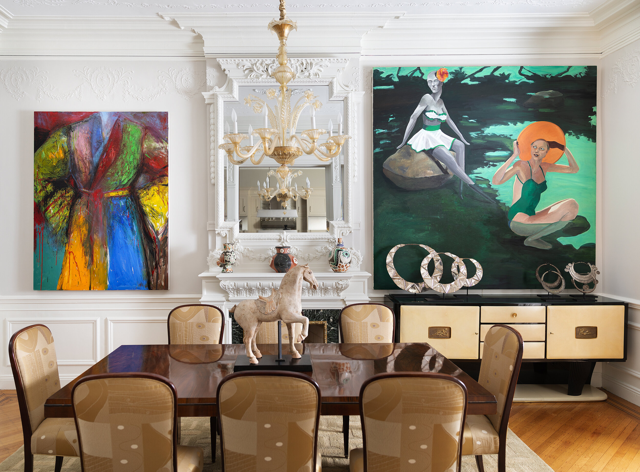 Interior, white walls with 2 paintings hanging parallel