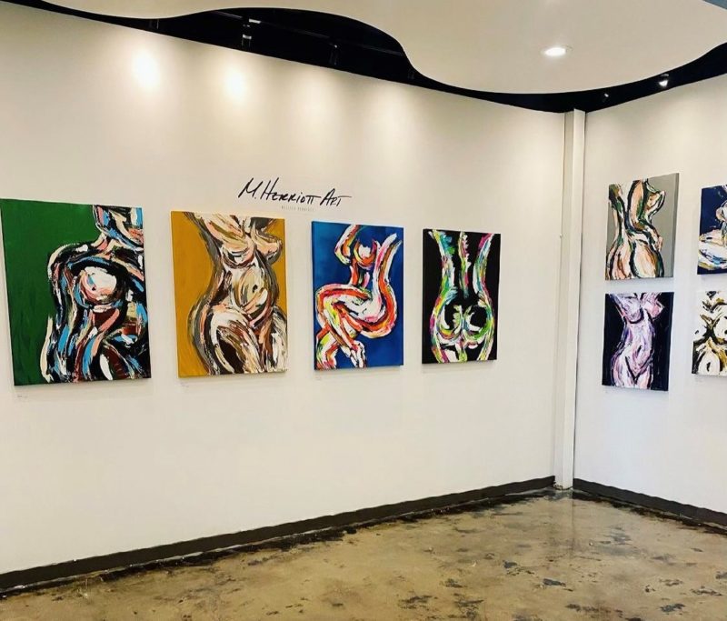 Interior shot of artwork on white walls