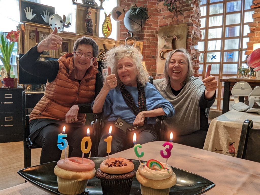 Marge, Ginny, and Nichole give thumbs up to the camera