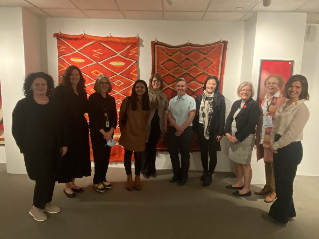 10 women pose for a photo