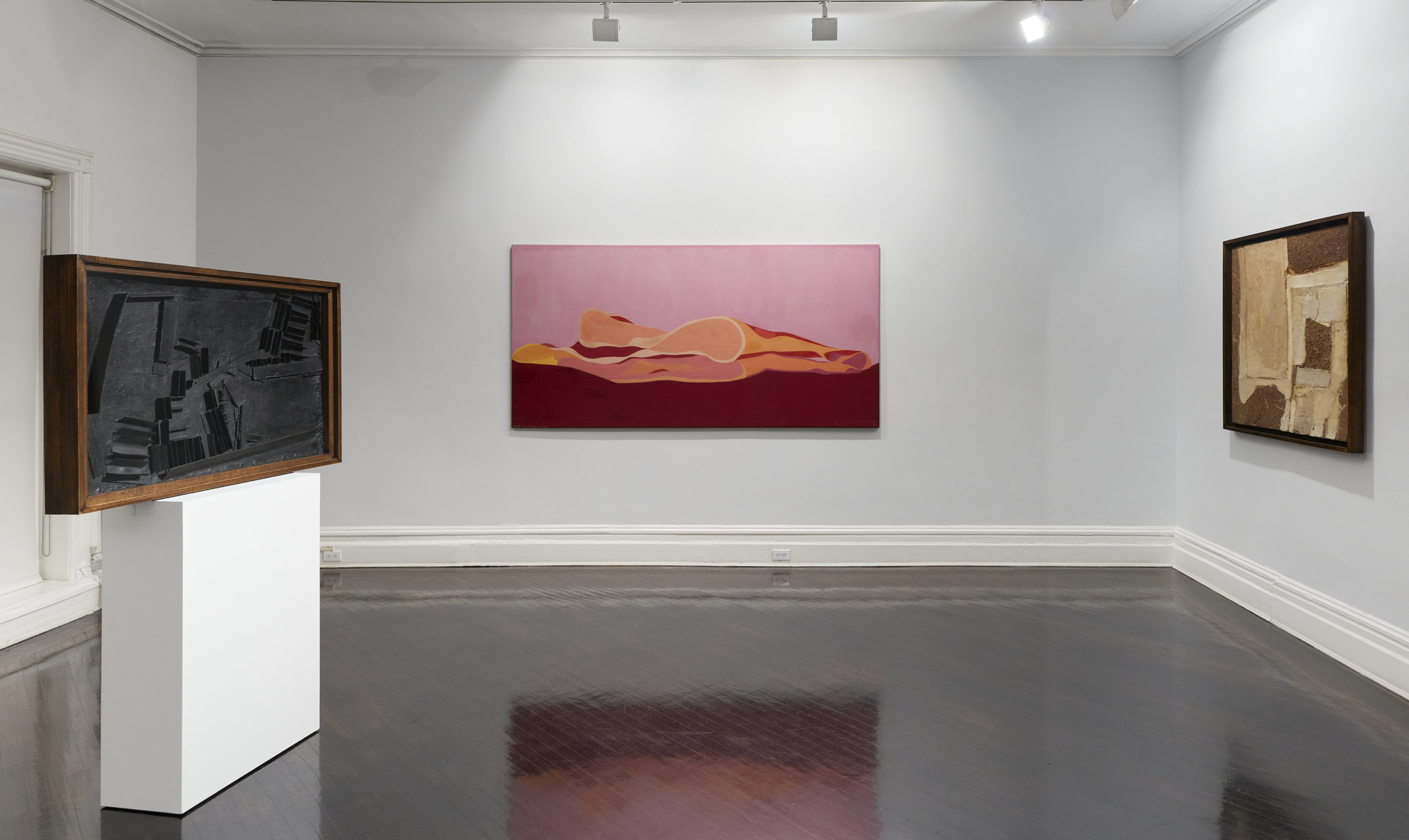 3 artworks by Marta Minujín are displayed in a room with white walls