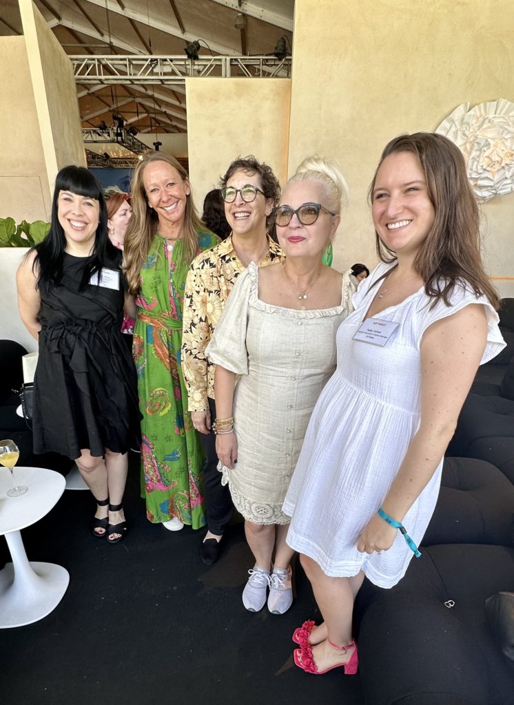 5 women pose for a photo