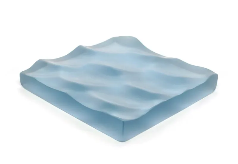 The sculpture "Seven Square Inches of Water" by Maya Lin. The sculpture mimics rolling waves.