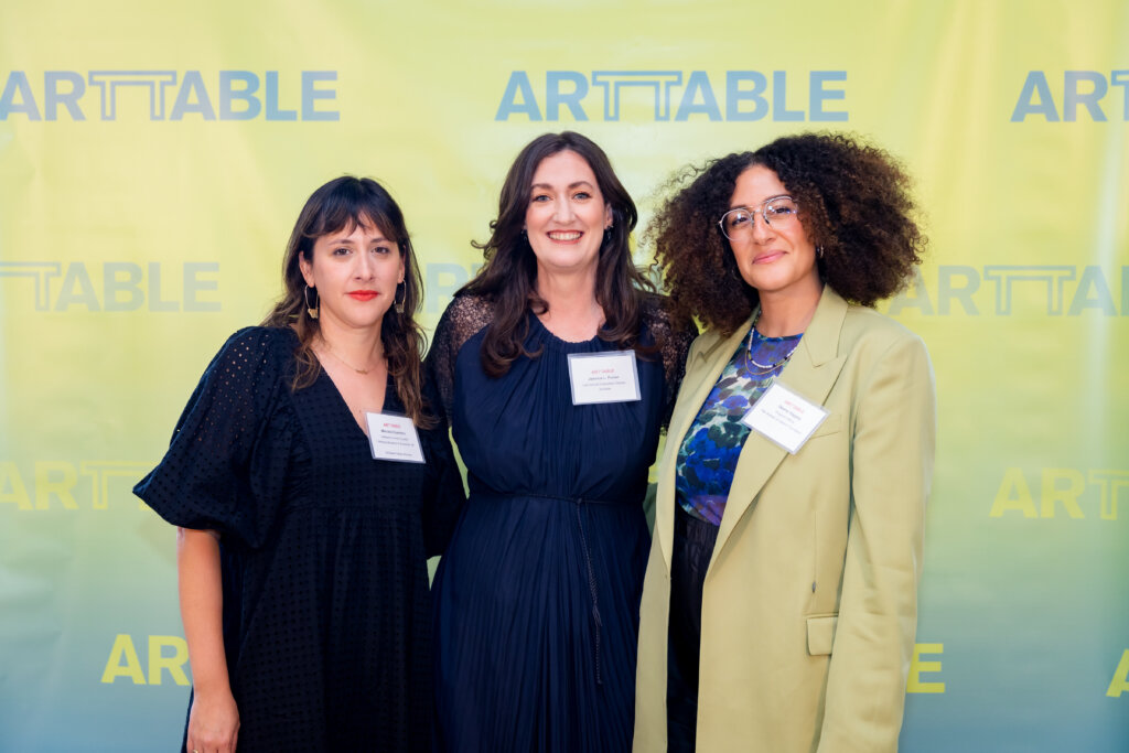 Three women smiling.