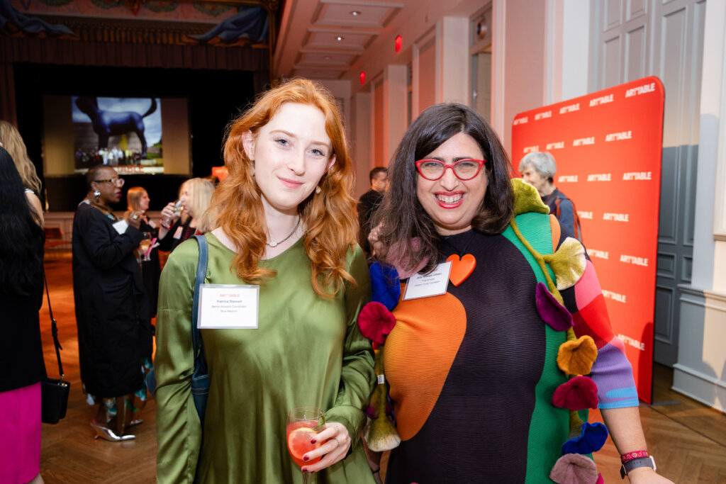 Two women pose for a photo