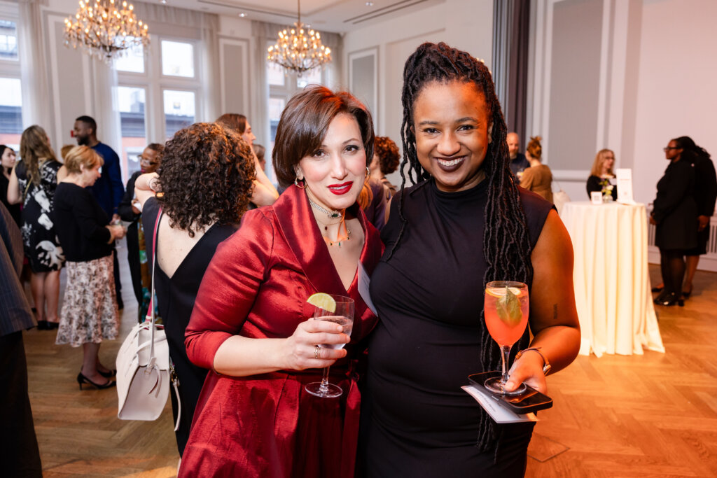 Two women pose for a photo
