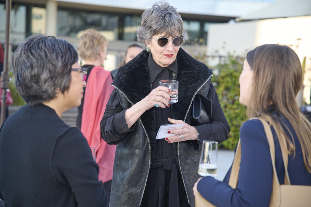 Three women talking.