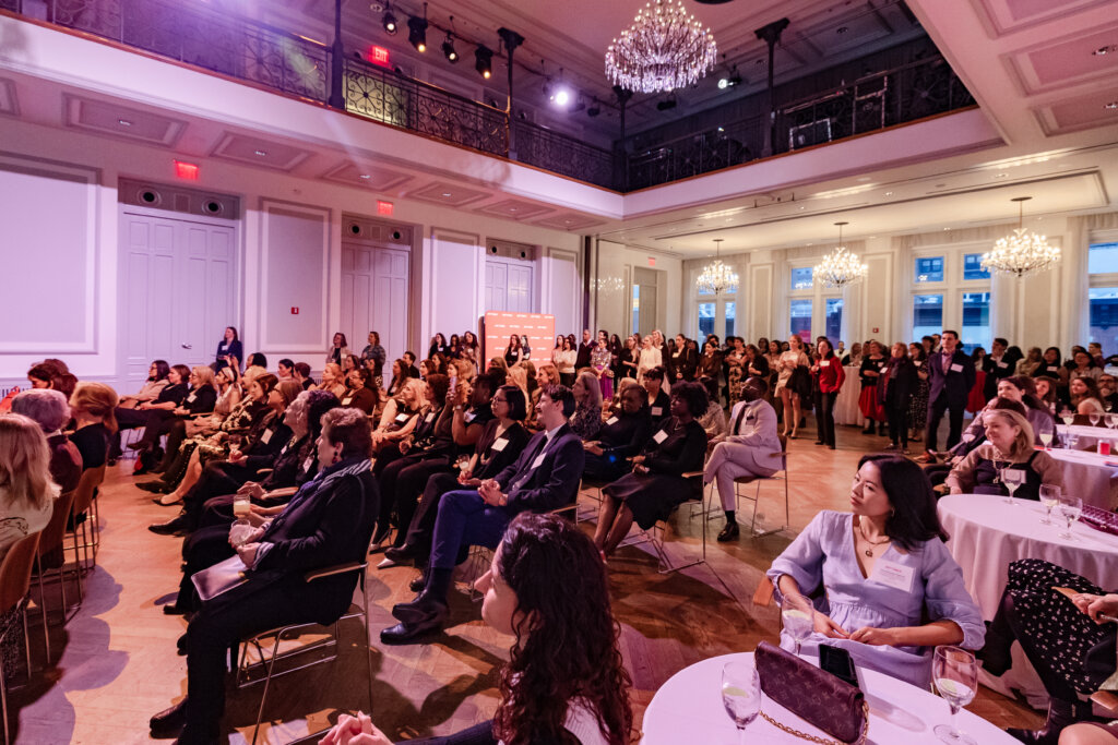 A crowd of people in an auditorium