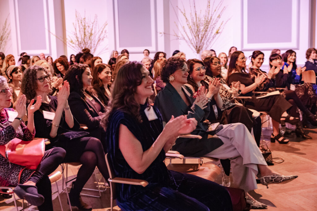 A crowd seated in an auditorium