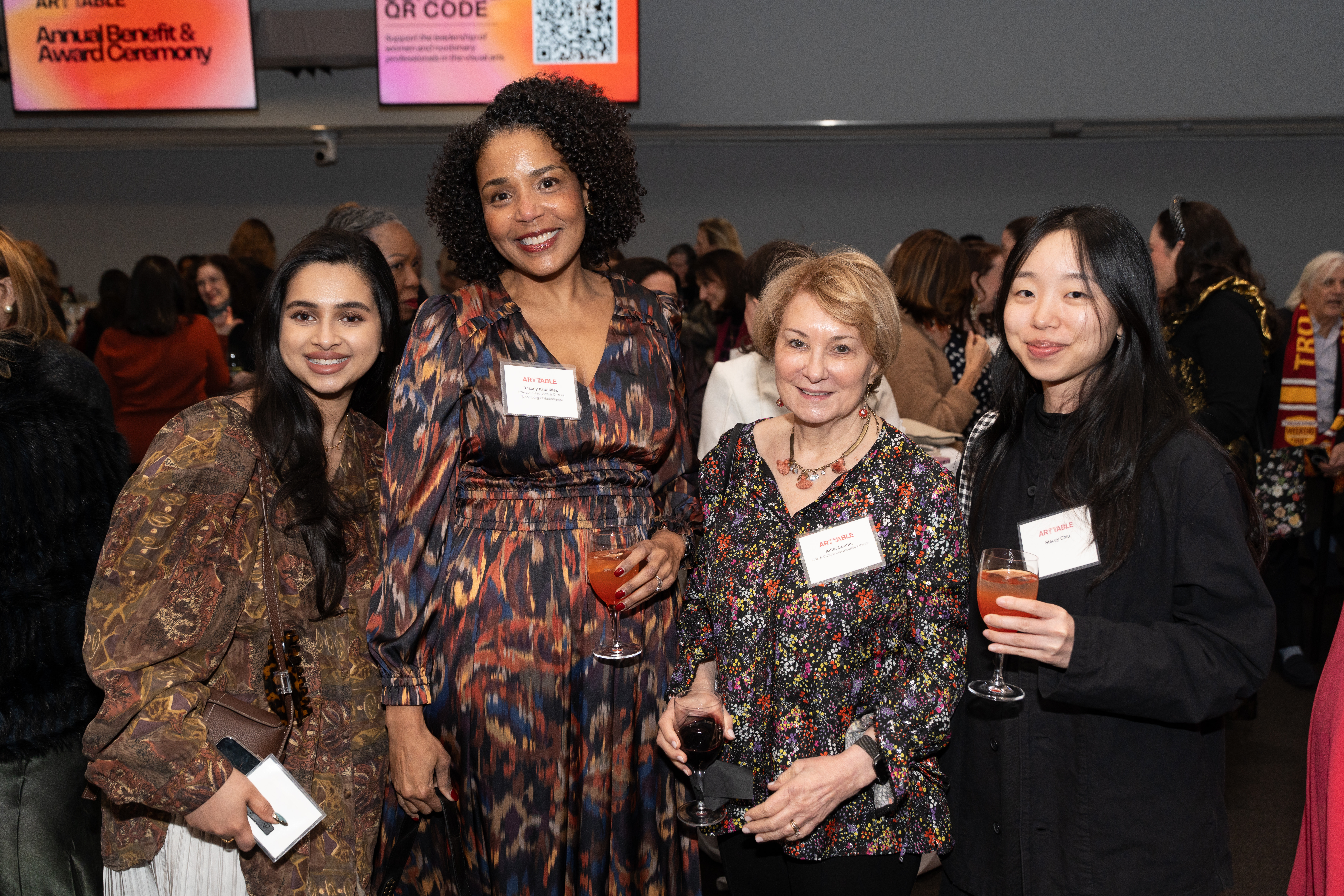 4 women smiling at the camera