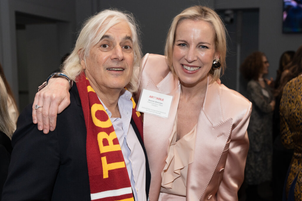 A man and a woman smile for the camera