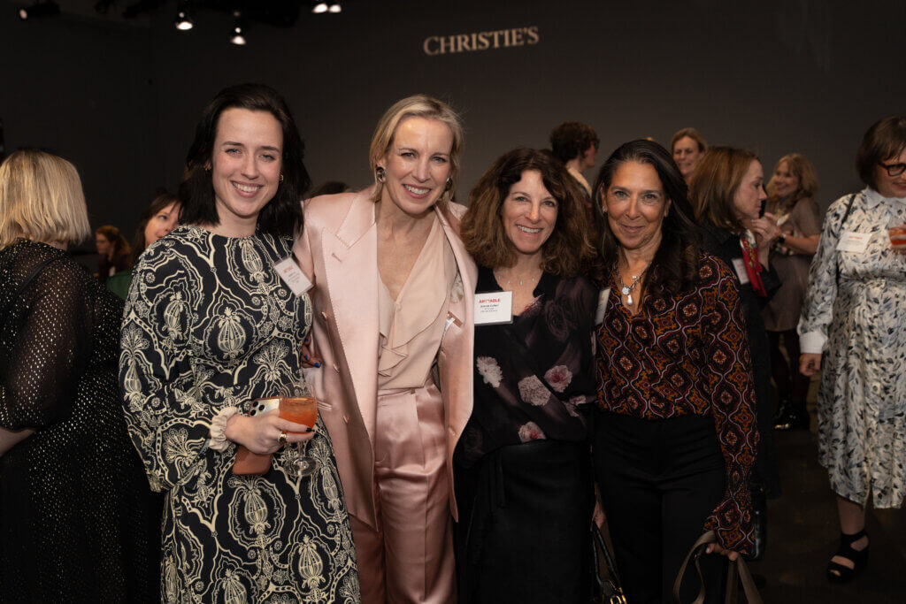 4 women smiling at the camera