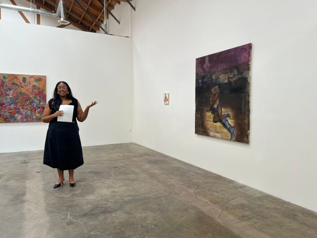 Cierra Britton leading the exhibition walkthrough