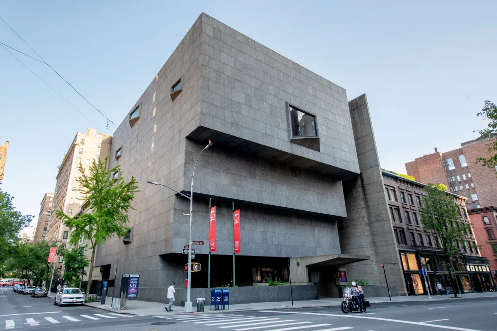 the sothebys breuer building exterior view. Grey building with multiple floors and each descending floor juts slightly more inward.